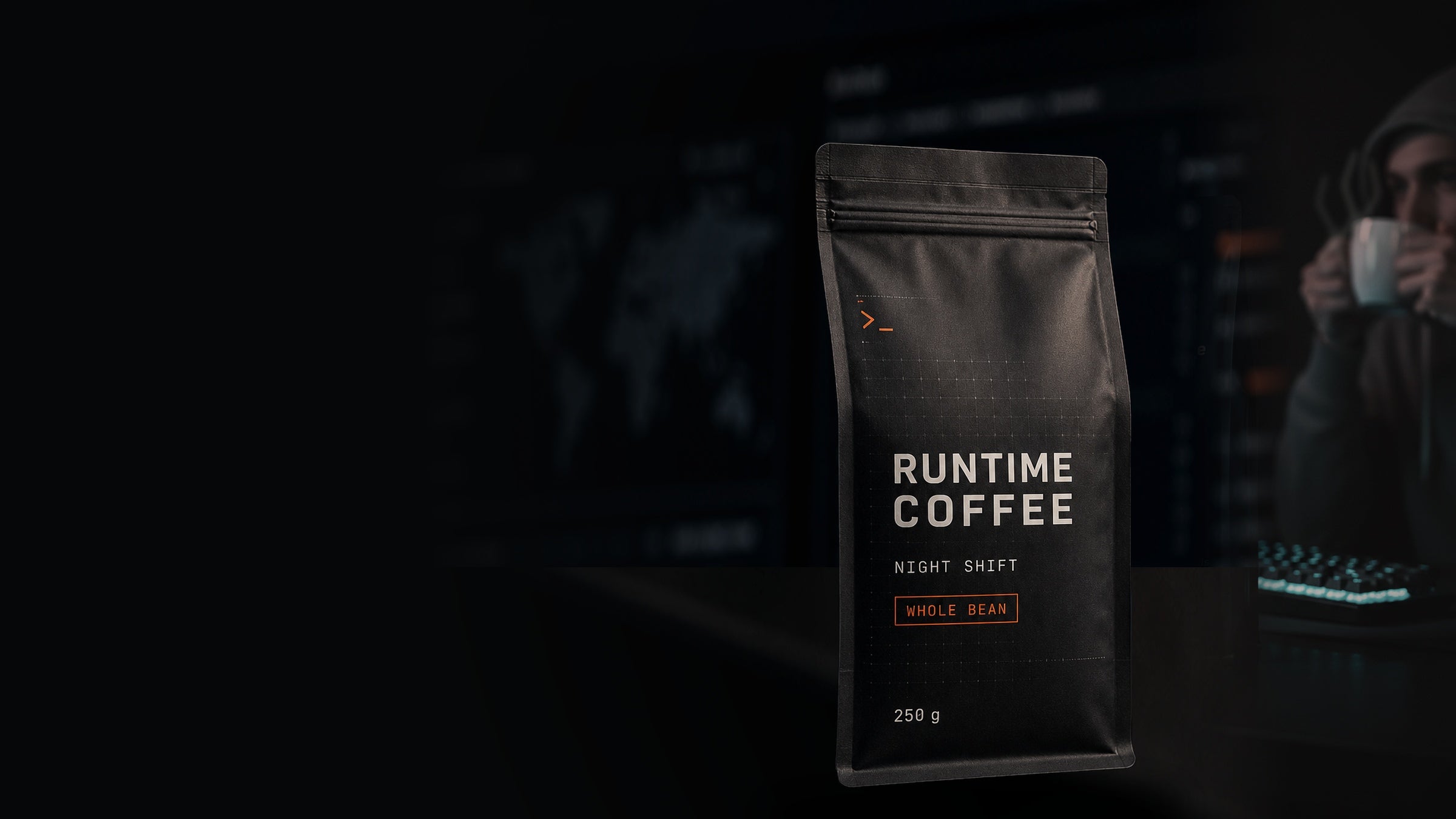 Runtime Coffee Night Shift bag beside a hooded technical operator drinking steaming coffee at a monitoring workstation